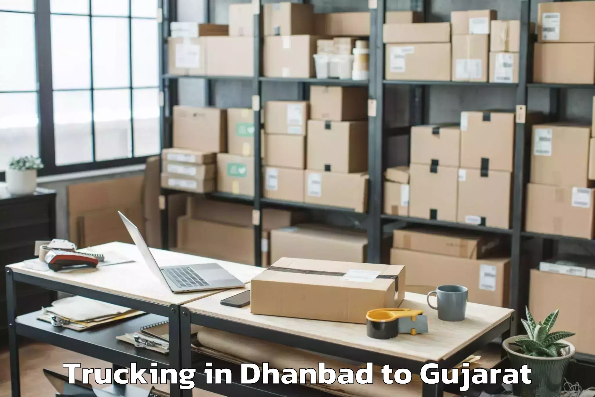 Easy Dhanbad to Valod Trucking Booking